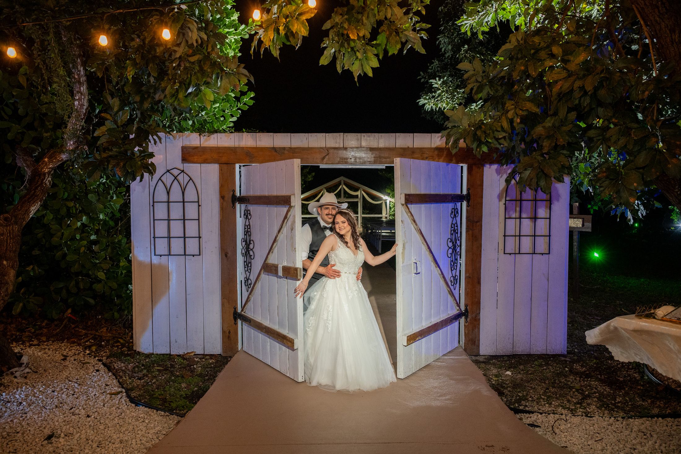Travel photographer with a hard-shell camera case at a Miami home gate, ready for a destination wedding