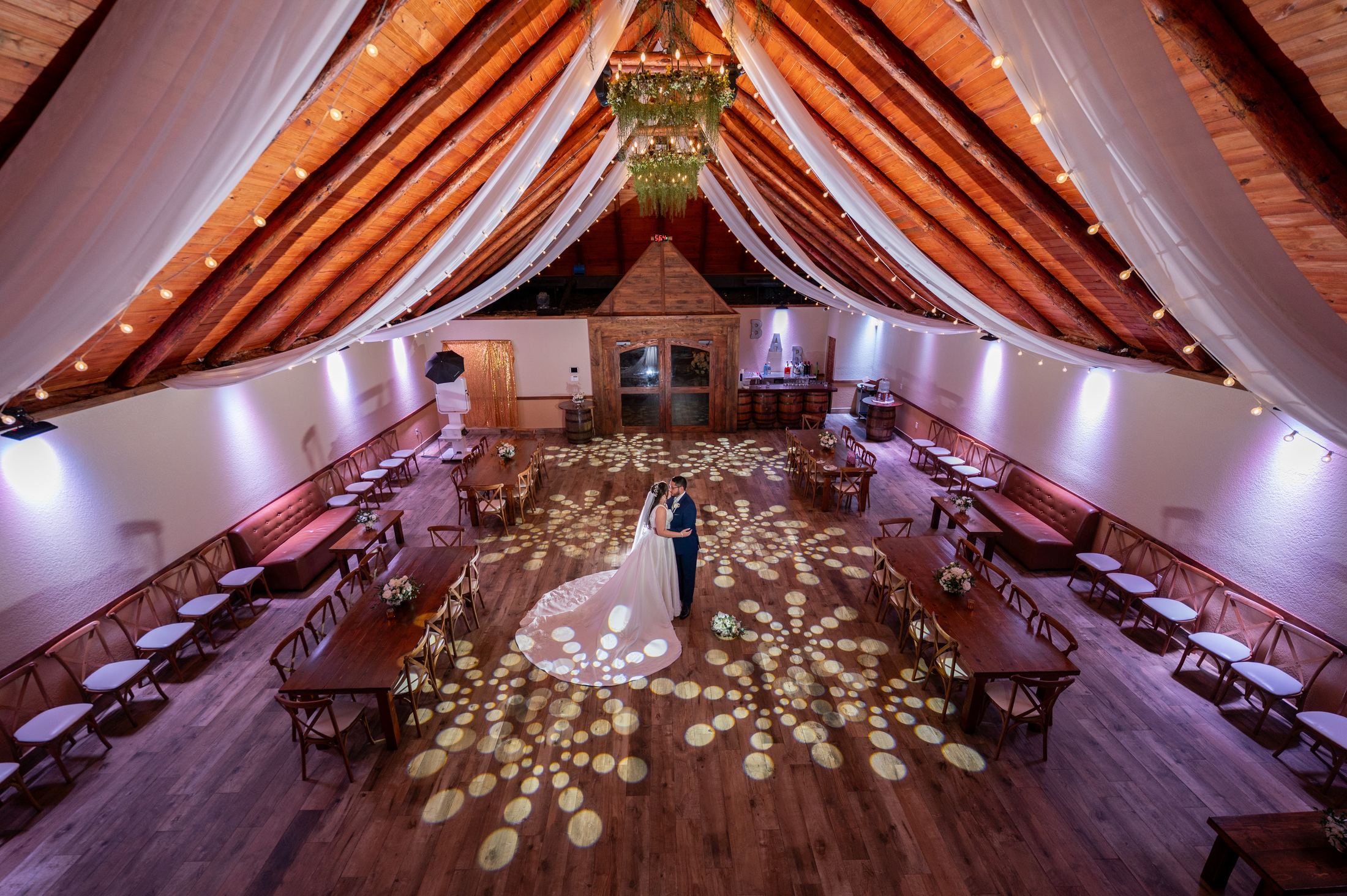 Photo booth attendant setting up a ring light inside a Miami residential venue